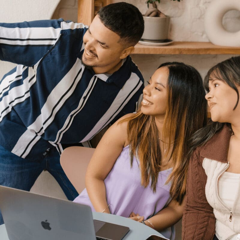 Social media insights being shared between the social media manager, website developer and graphics designer