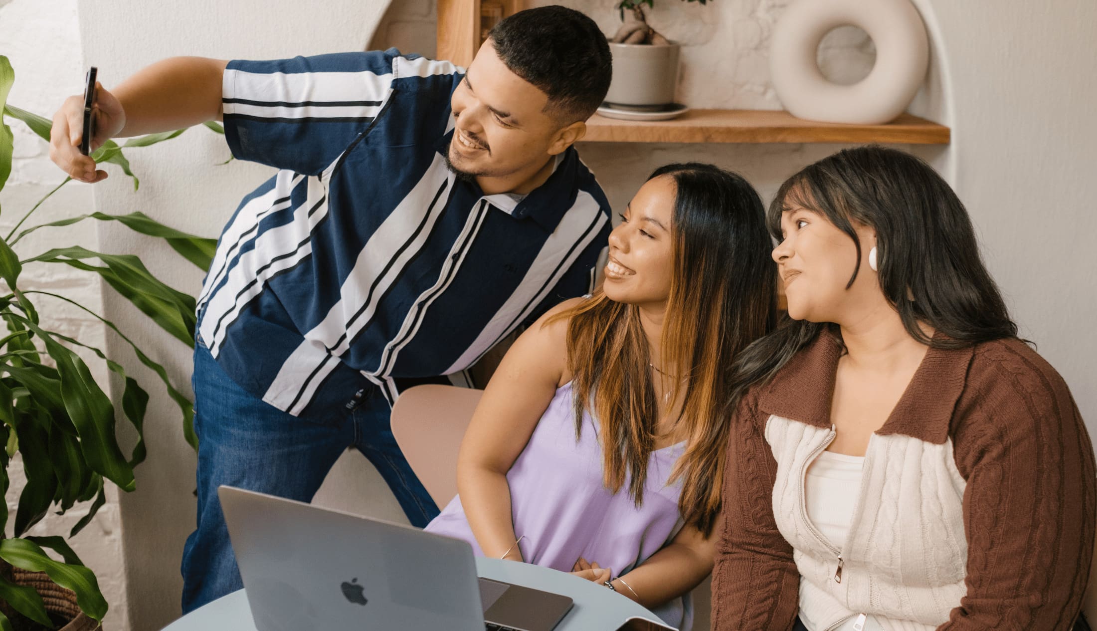 Social media insights being shared between the social media manager, website developer and graphics designer