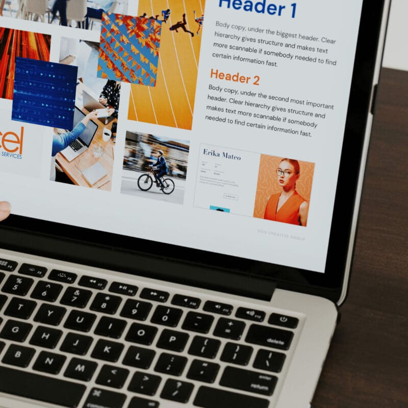 IT Accel's website being shown to the client on a laptop