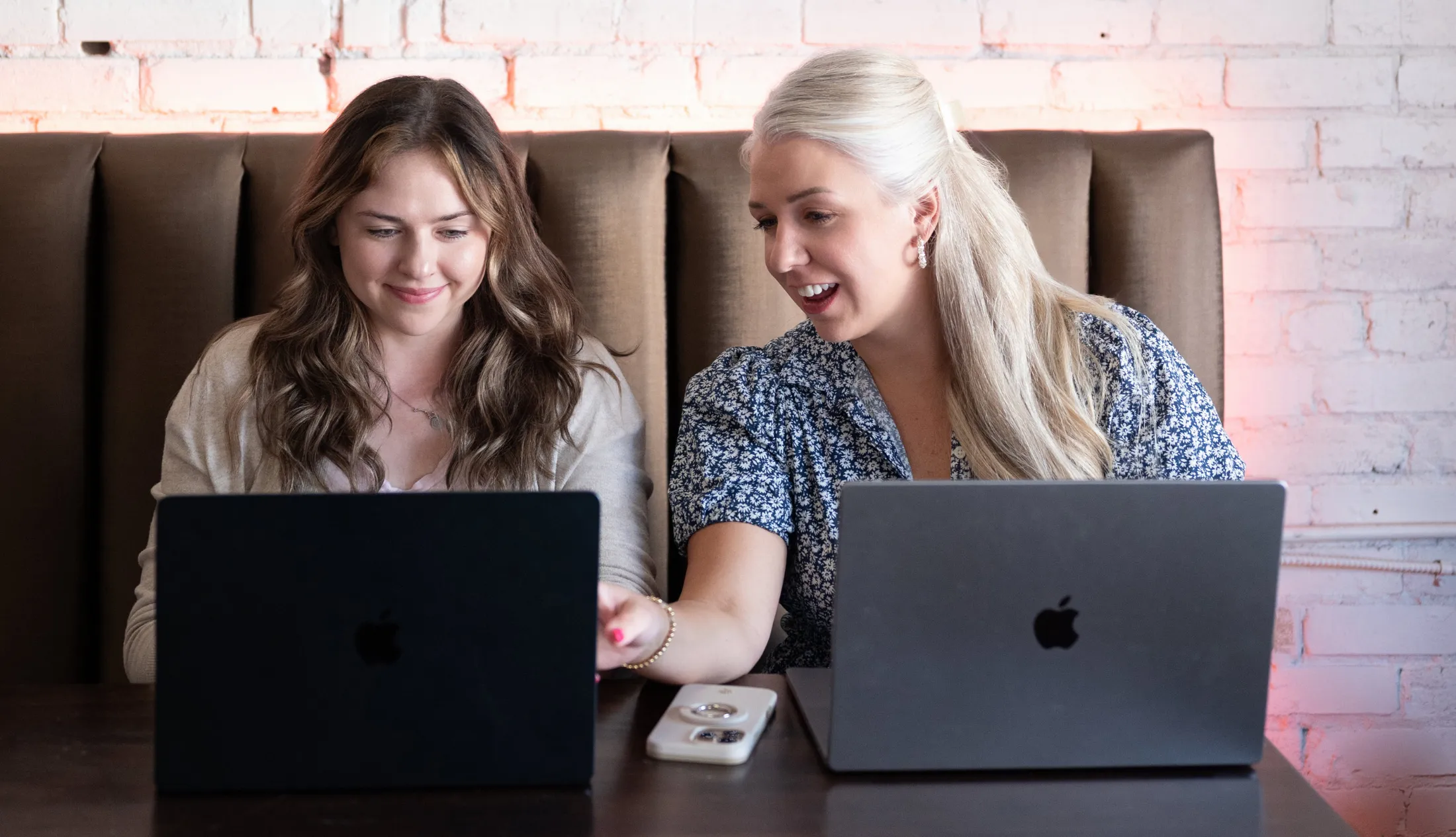 Team collaborating on logistics website development and SEO improvements using laptops
