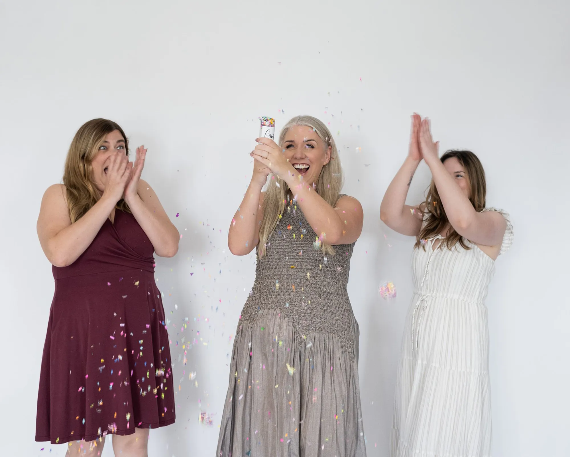 Team celebrating a milestone with confetti and shared excitement