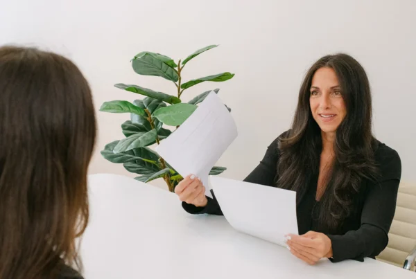 ITAccel executive reviewing documents with candidate during professional staffing consultation