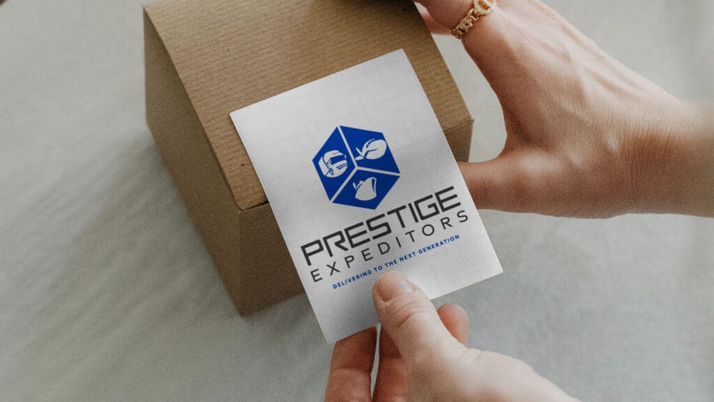Prestige Expeditors logistics logo label on cardboard shipping box