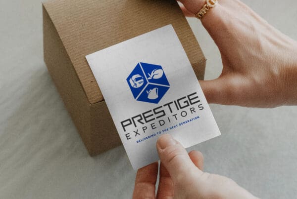 Prestige Expeditors logistics logo label on cardboard shipping box