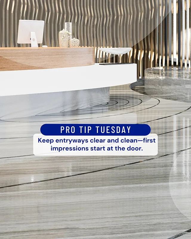 Clean and modern commercial lobby with polished floors and a reception desk, highlighting a Pro Tip Tuesday message about keeping entryways clear for strong first impressions