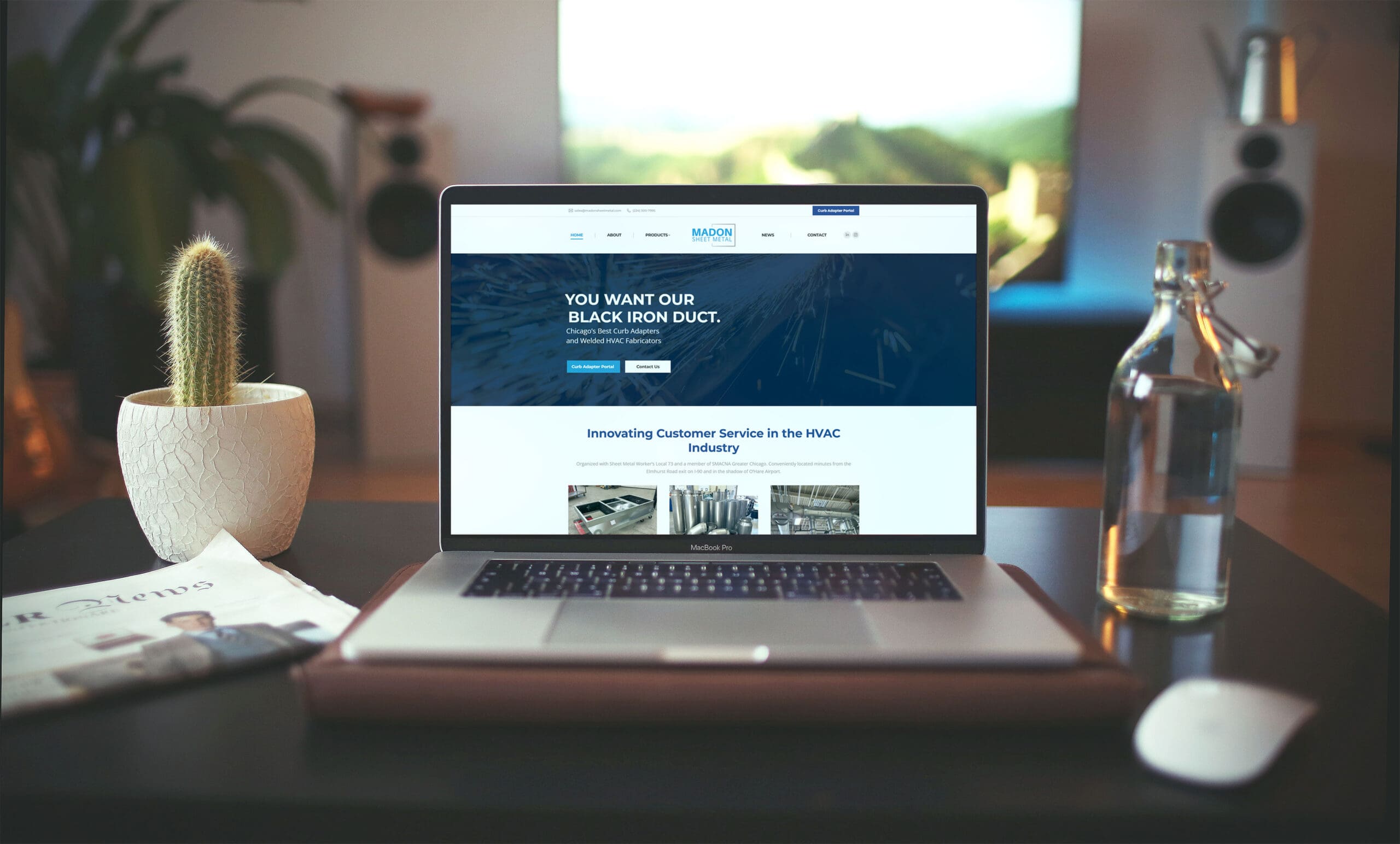 Laptop displaying the Madon Sheet Metal website homepage focused on HVAC duct fabrication and customer service