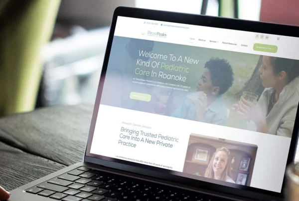 Three Peaks Pediatrics website displayed on a laptop showing pediatric care homepage