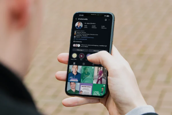 Person viewing a professional Instagram profile on a smartphone during social media planning