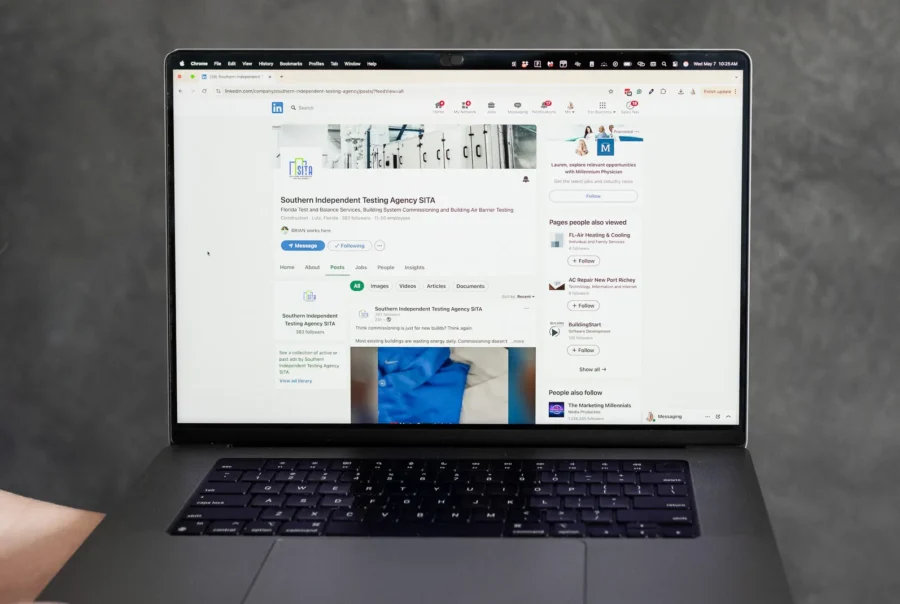 Laptop displaying a LinkedIn company page and post analytics, representing social media updates, content strategy planning, and professional platform engagement